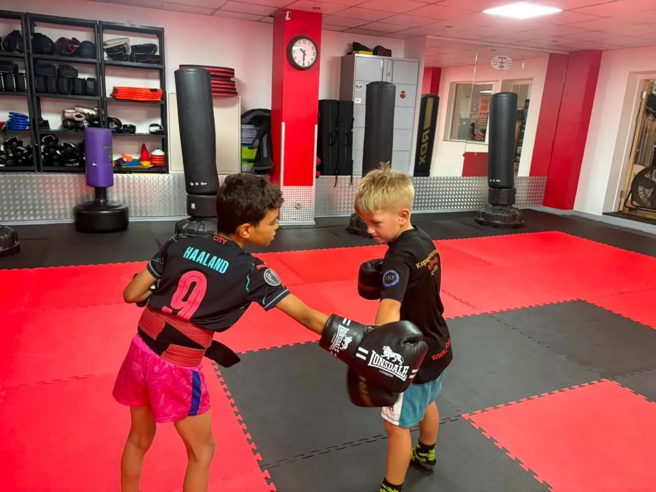 Junior students practising pad work at The Black Belt Foundation Chorley